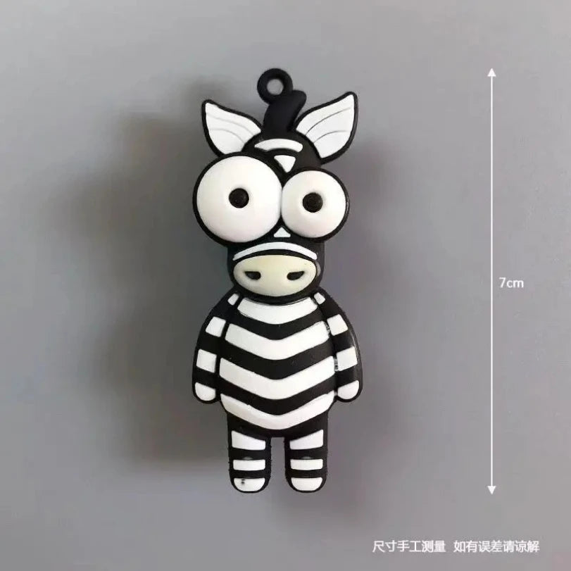 A black and white striped cartoon zebra fridge magnet with an opening at the top.