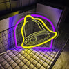 A glowing yellow bell shape neon sign is displayed on a textured surface with purple and yellow light effects.