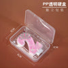 Clear plastic packaging for a set of pink glitter birthday candles with a crown design