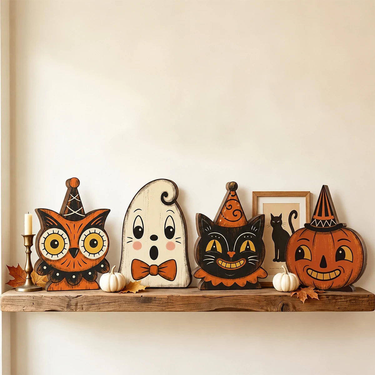 A wooden block Halloween decor set featuring an owl, a ghost, and a cat carved in orange and black tones.