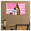 A female athlete in a sports jersey is featured on a pink and white American flag tapestry wall hanging.