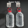 Two clear plastic water bottles hanging from metal wall hooks for home organization
