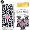 Ten cow print number foil balloons in black and white with a pink face design