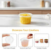 Clear disposable dessert cups with lids shown on a white surface, highlighting their secure and leak-proof design.