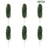 Six pieces of artificial tropical palm leaves used for party decoration