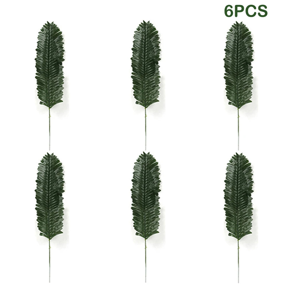 Six pieces of artificial tropical palm leaves used for party decoration