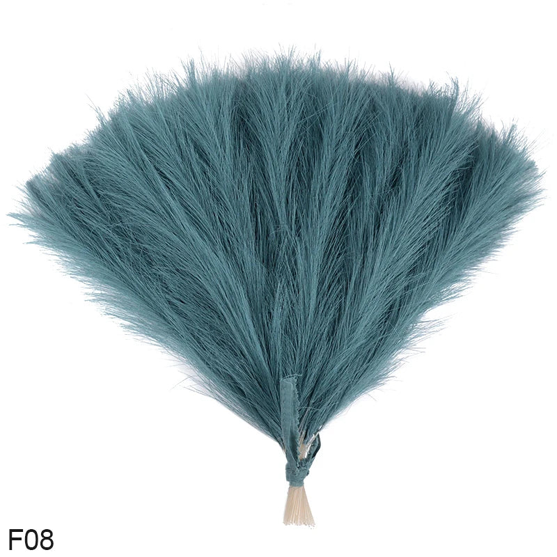 A fluffy, teal-blue artificial reed bouquet with a tapered shape.