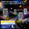 Solar garden lights with a starburst effect illuminating a pathway and garden at night