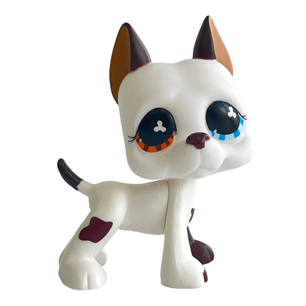 A white bobblehead figure of a dog with brown ears and a cat-like face.