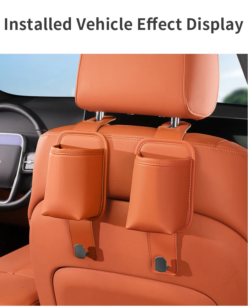 Installed vehicle effect display showing an orange car seat back organizer and headrest hanger.