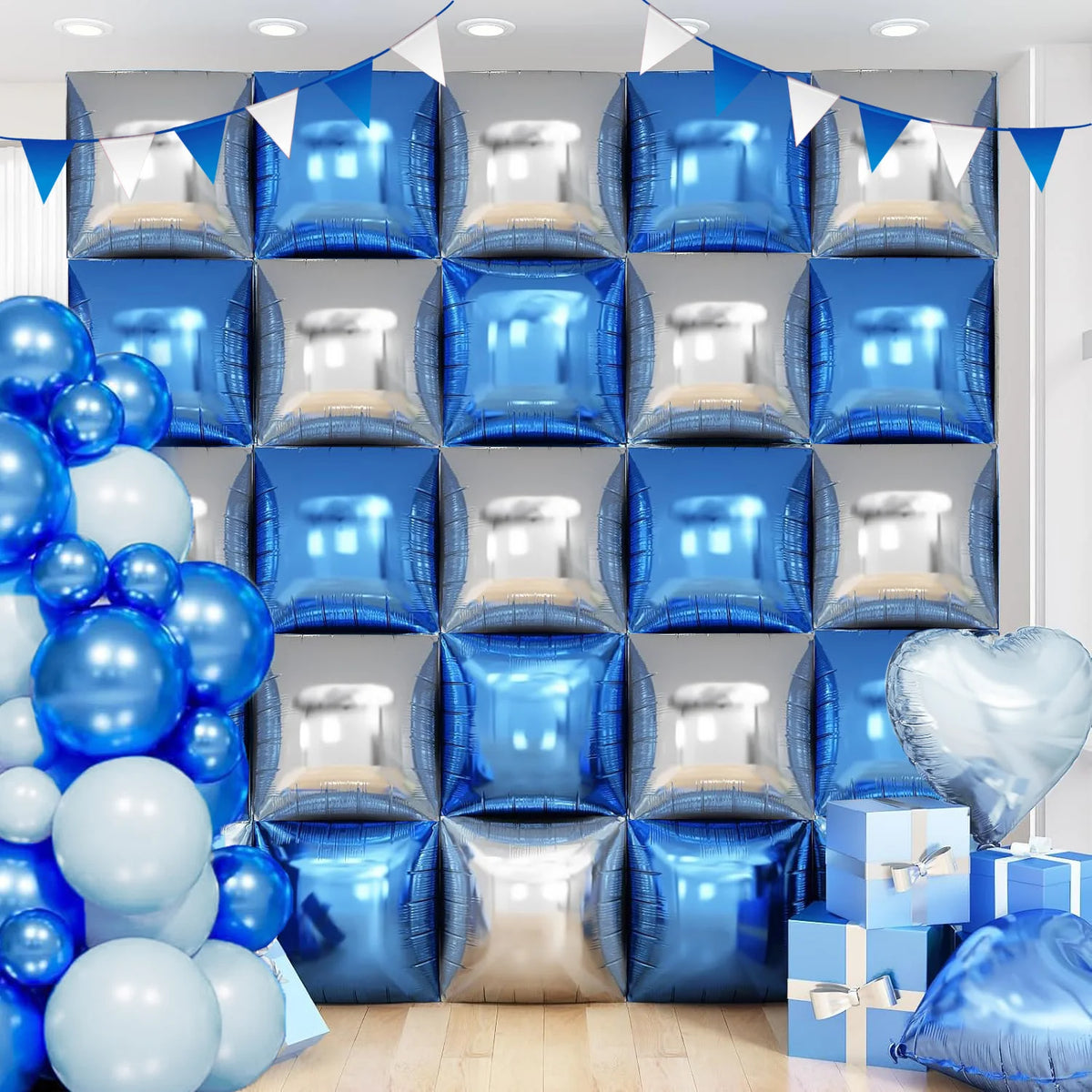 Blue and silver foil balloon wall panels arranged in a grid with blue balloons and a heart shape