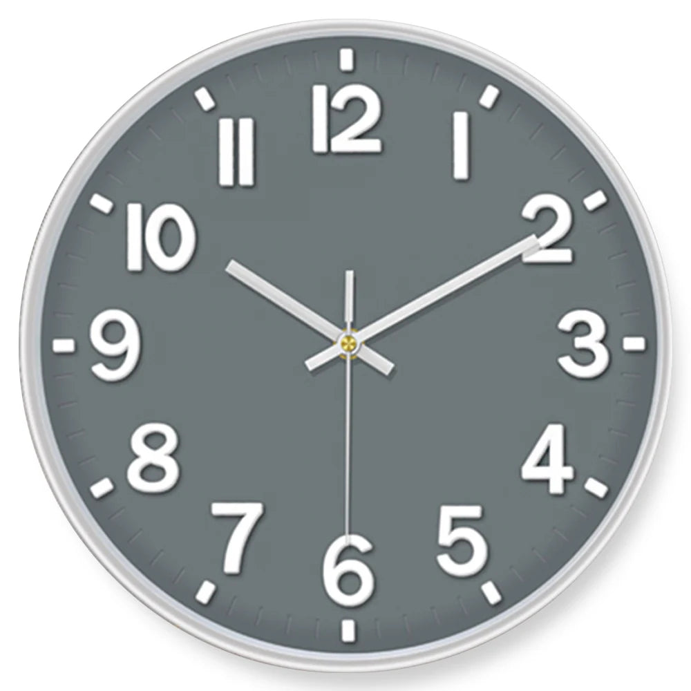 A minimalist gray wall clock face showing the time as approximately 12:30.