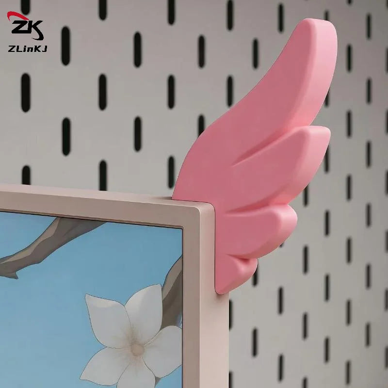 Pink 3D printed LED monitor wing decorations displayed against a patterned background.