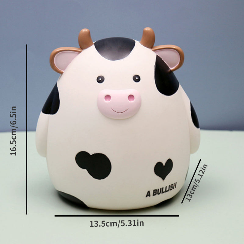 A cute white and black cow figurine with pink nose and horns, designed as a money saving jar for kids.