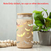 A glass jar decorated with vinyl stickers of various bat silhouettes and stars.