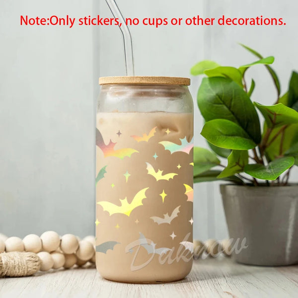 A glass jar decorated with vinyl stickers of various bat silhouettes and stars.
