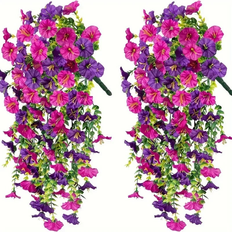 A vibrant artificial morning glory garland featuring purple and pink flowers.