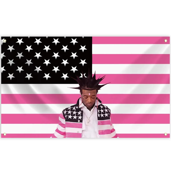 A person wearing a patriotic themed jacket stands in front of a pink and white striped flag background.