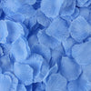 A close-up view of light blue artificial silk rose petals scattered densely.