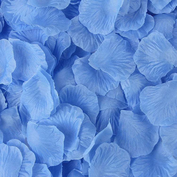 A close-up view of light blue artificial silk rose petals scattered densely.