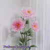 A bouquet of pink silk poppy flower heads and stems with a green base displayed against a white background.