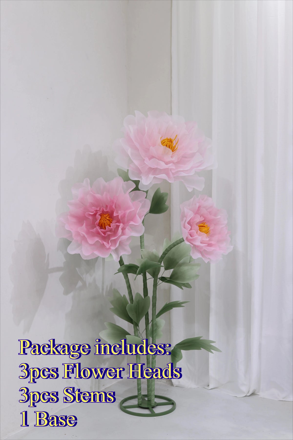A bouquet of pink silk poppy flower heads and stems with a green base displayed against a white background.