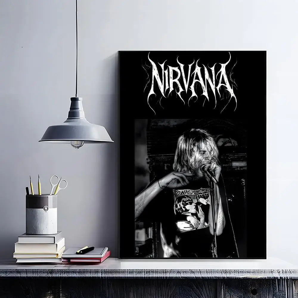 A black poster featuring the Nirvana logo in white, displayed on a shelf with books and a lamp.