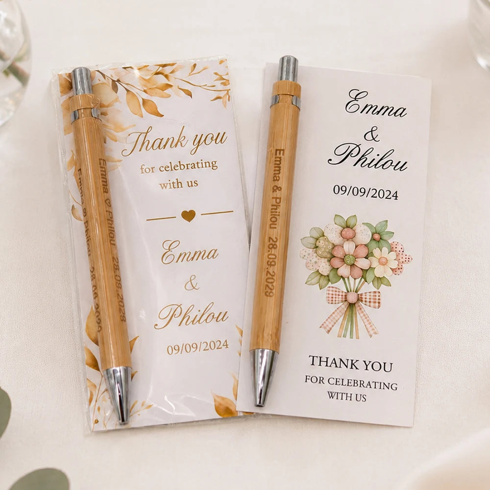 Two personalized engraved bamboo pens and thank you cards for a wedding or celebration.
