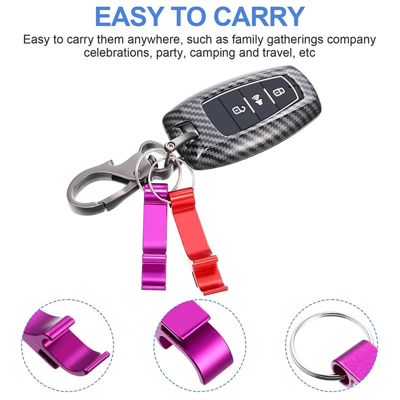 A set of pink and red aluminum bottle opener keychains attached to a black patterned keychain.