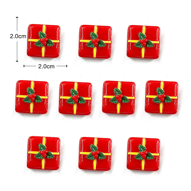 Un juego de imanes navideños rojos con detalles de hiedra verde.
