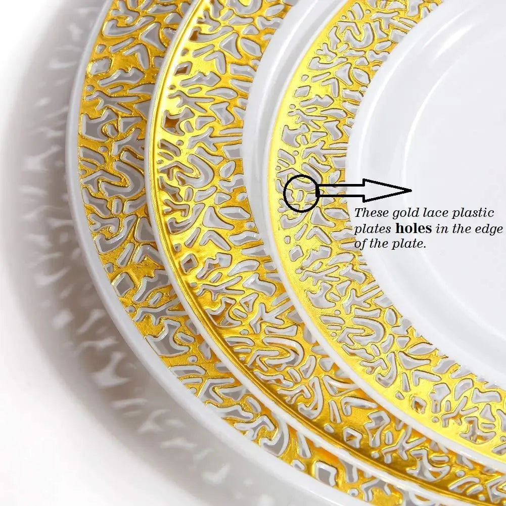 Close-up of an elegant gold rim plastic dinner plate showing decorative lace patterns and holes in the edge.