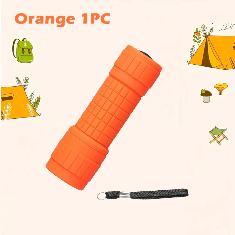 Orange 1PC compact flashlight with a black magnetic tip shown next to camping gear.
