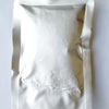 A white refill pouch of titanium powder for a cold spark machine.