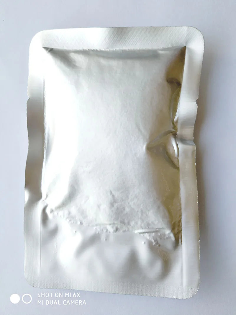 A white refill pouch of titanium powder for a cold spark machine.