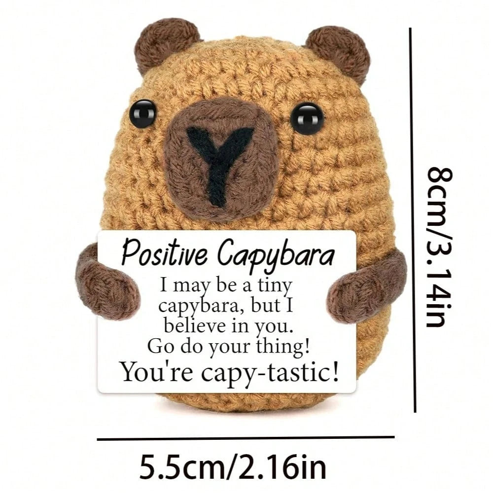 Hand-woven capybara plush pendant with an encouraging card featuring a positive message