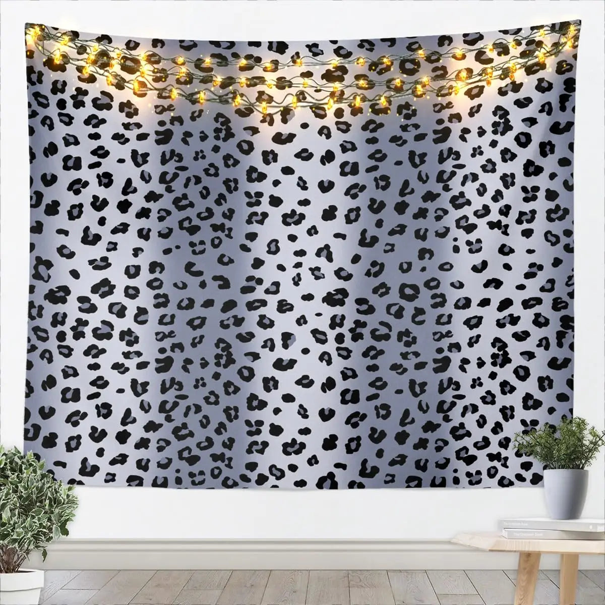 Leopard print tapestry wall hanging featuring a wild animal pattern with string lights.