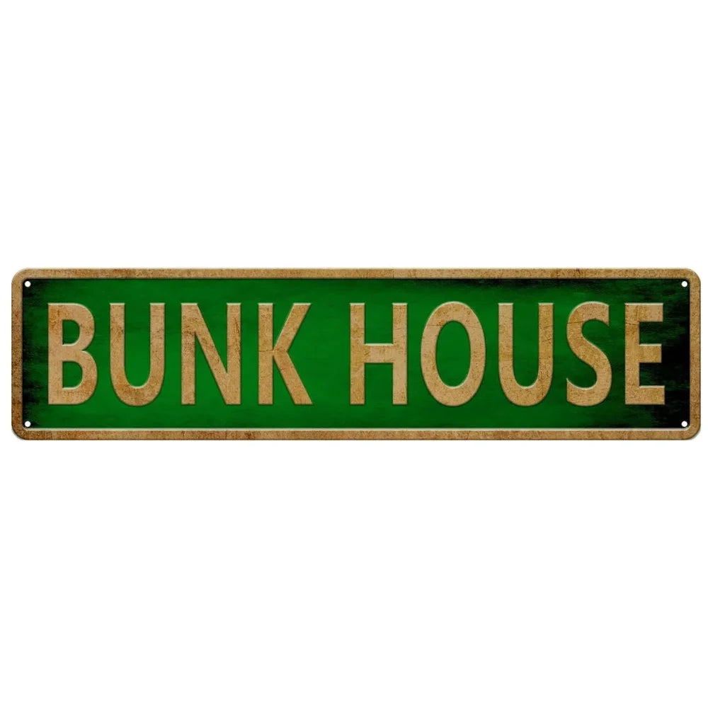 A rectangular green metal tin sign with the words BUNK HOUSE in gold lettering.