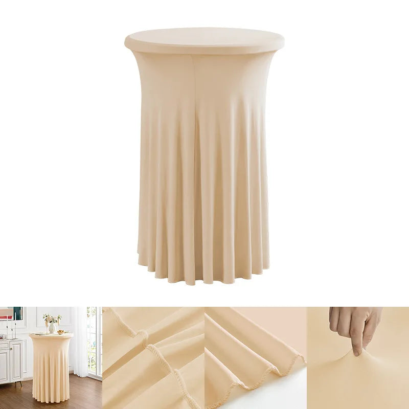 A floor-length, pleated beige stretch spandex cocktail tablecloth with a gathered skirt.