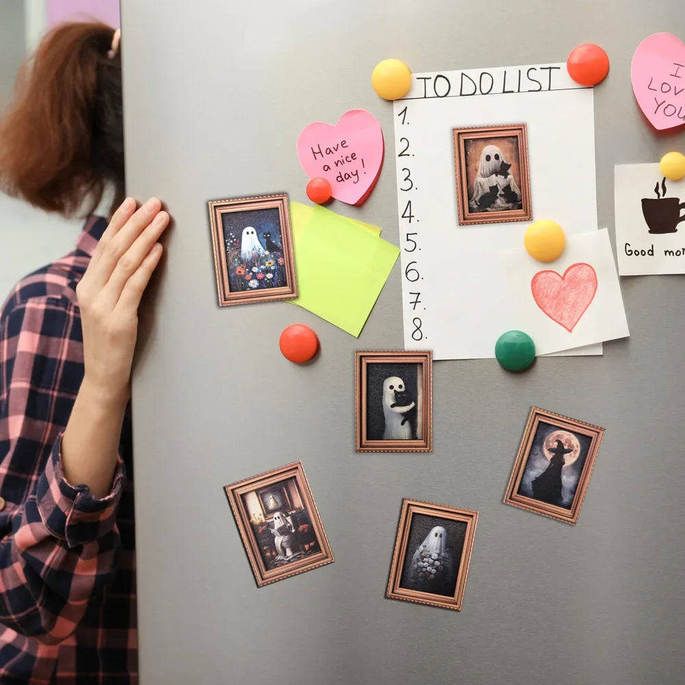 A collection of 3D retro Halloween fridge magnets featuring ghosts and pumpkins arranged on a gray surface.