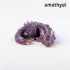 A natural amethyst crystal figurine shaped like a dragon for Feng Shui decor.