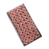 A tray filled with pink artificial rose heads used for wedding and party decoration.
