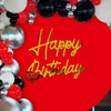 Red background decorated with silver, black, and red spherical mirror acrylic wall stickers spelling out Happy Birthday