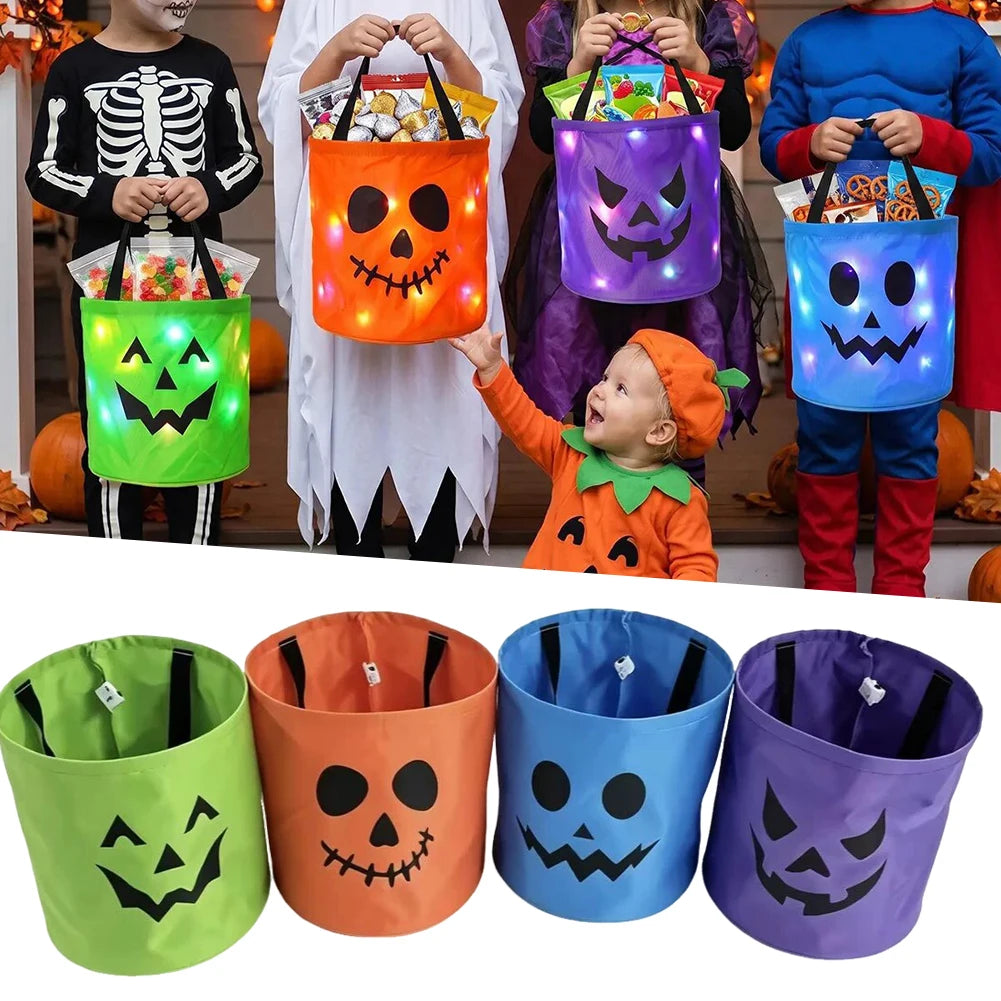 A collection of LED illuminated Halloween trick-or-treat bags in various colors and designs for children.