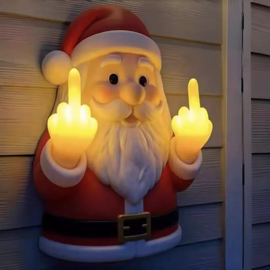 A glowing Santa Claus figure with a white beard and red suit making a middle finger gesture.