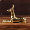 Handmade Egyptian Pharaoh dog statue in gold color shown from the side