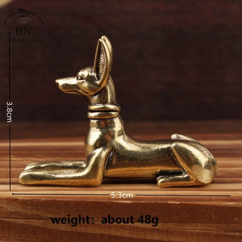 Handmade Egyptian Pharaoh dog statue in gold color shown from the side