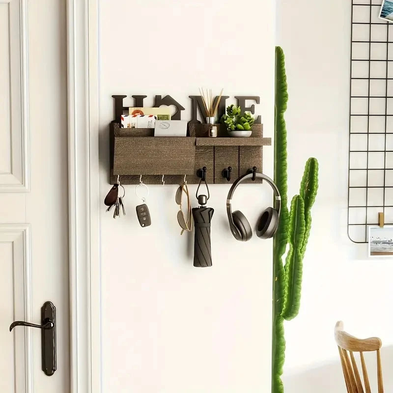 A rustic wooden wall key holder with a shelf and seven hooks mounted on a white wall.