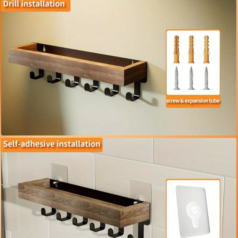 A rustic wooden floating shelf with hooks installed on a white wall, showing both drill and self-adhesive installation method