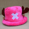 A pink plush knit cap featuring a white cross design and brown ear accents.