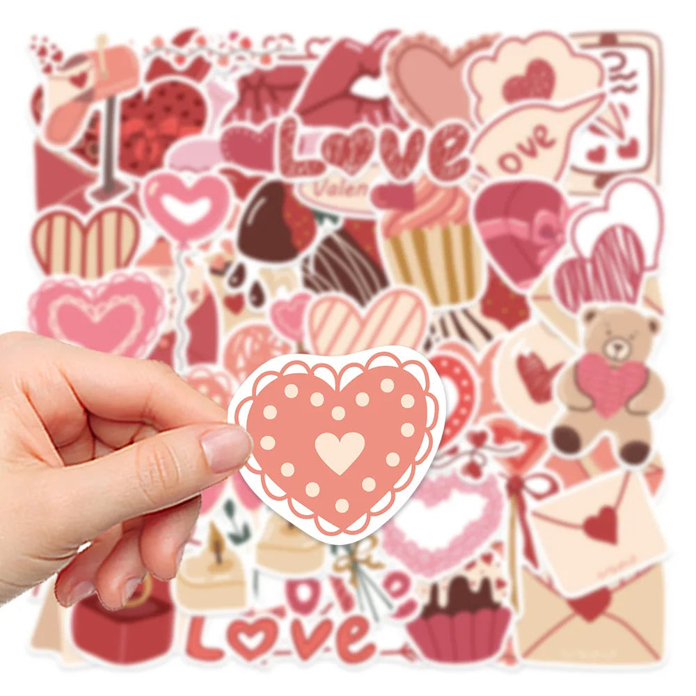 A hand holds a sheet of pink and red love-themed decorative stickers featuring hearts, lips, and teddy bears.